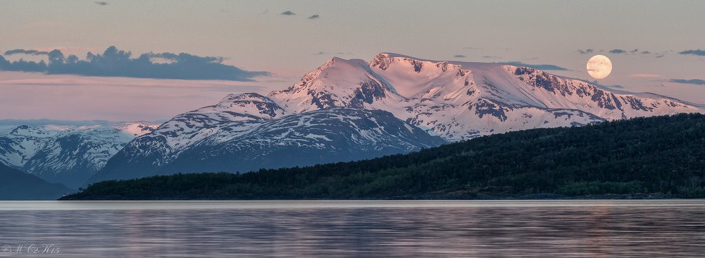 Midnight sun and full moon