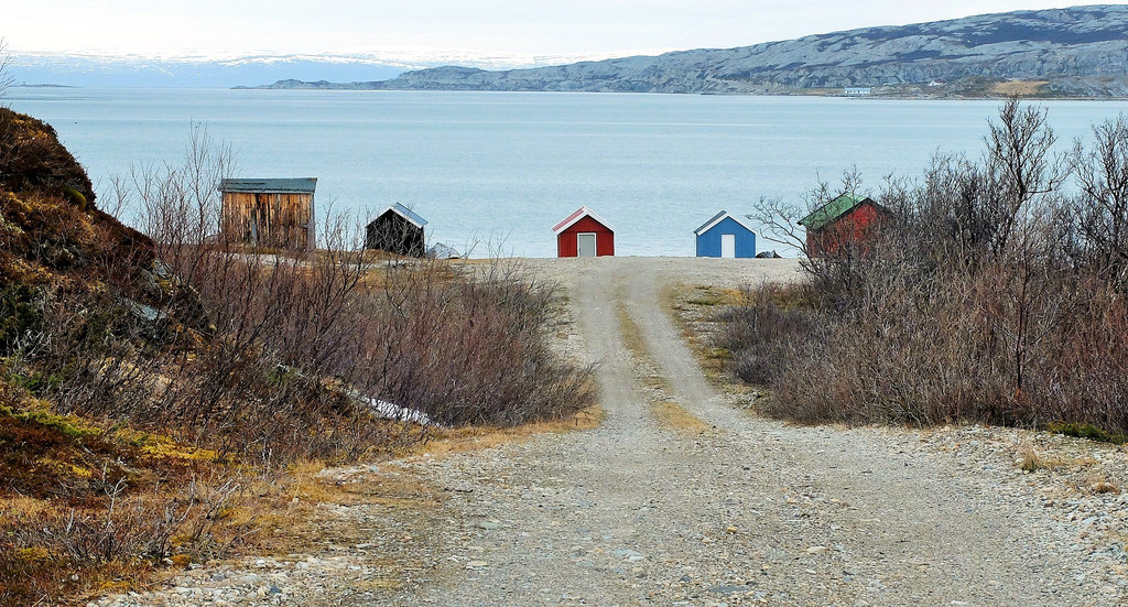 A bunch of small boathouses