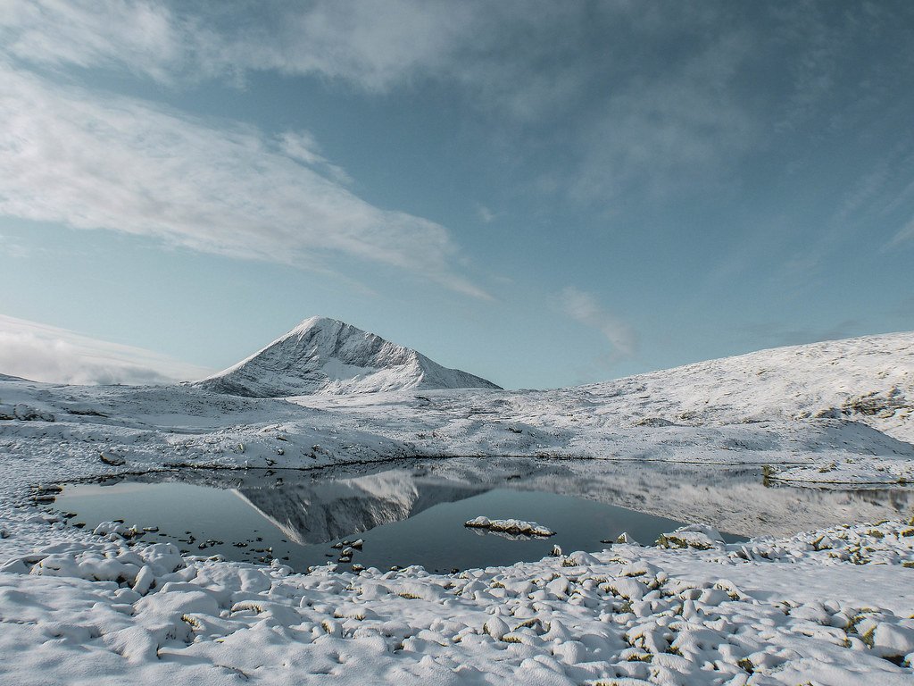 Snowy lake and Tromsdalstin