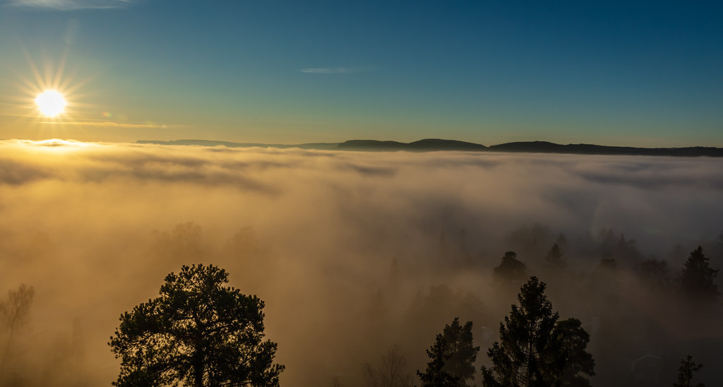Sunset above the fog by Tho